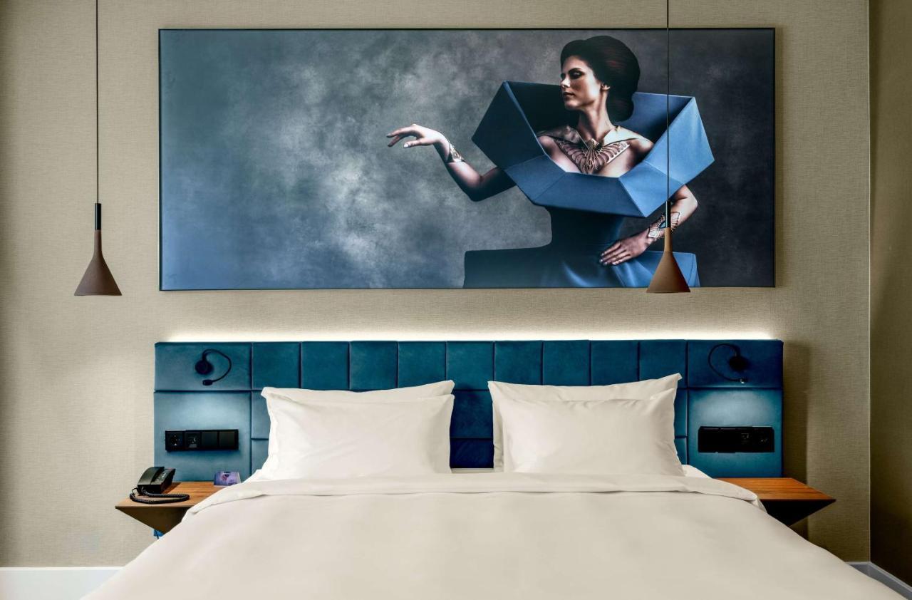Radisson Blu Aurum Hotel, Brašov Exteriér fotografie A bedroom at the hotel